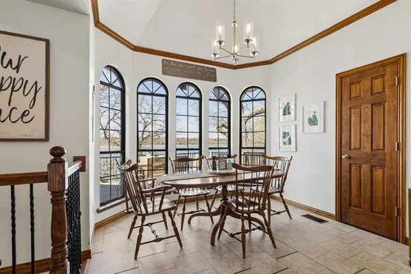 a view of a dining room with furniture window and outside view
