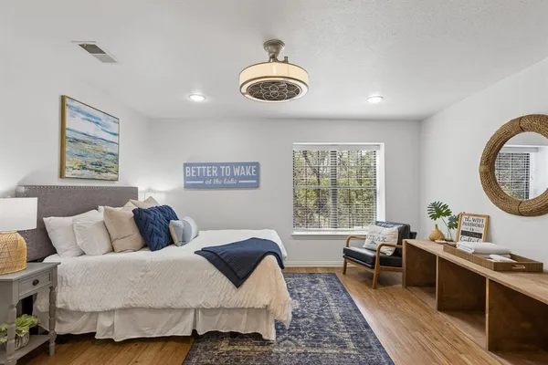 a bedroom with a bed and window