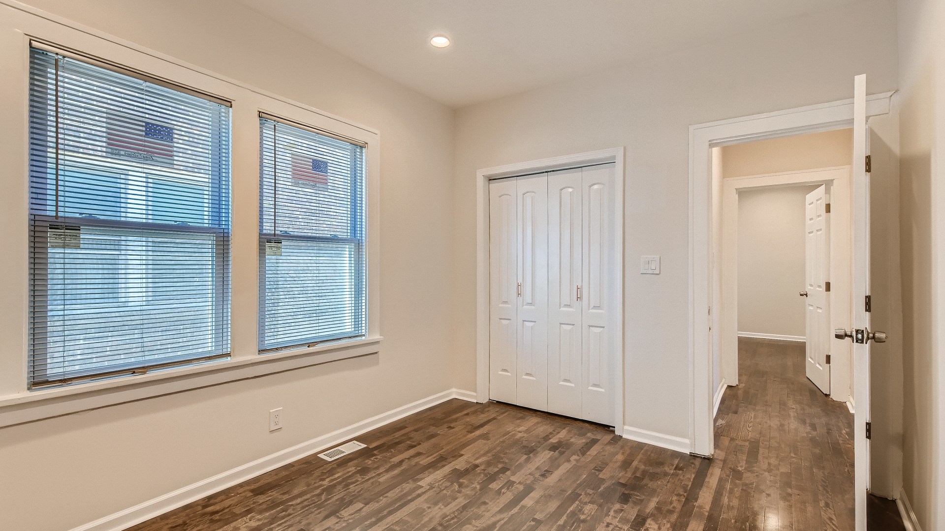 506 Pulaski Road Calumet City, IL 60409 - Photo 11 of 30 a view of an empty room with wooden floor and a window