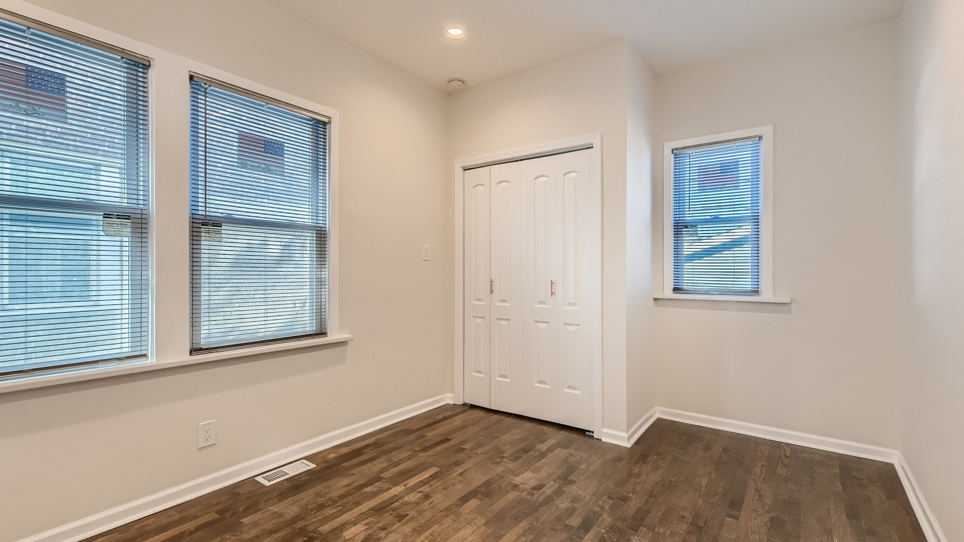 506 Pulaski Road Calumet City, IL 60409 - Photo 15 of 30 an empty room with wooden floor and windows