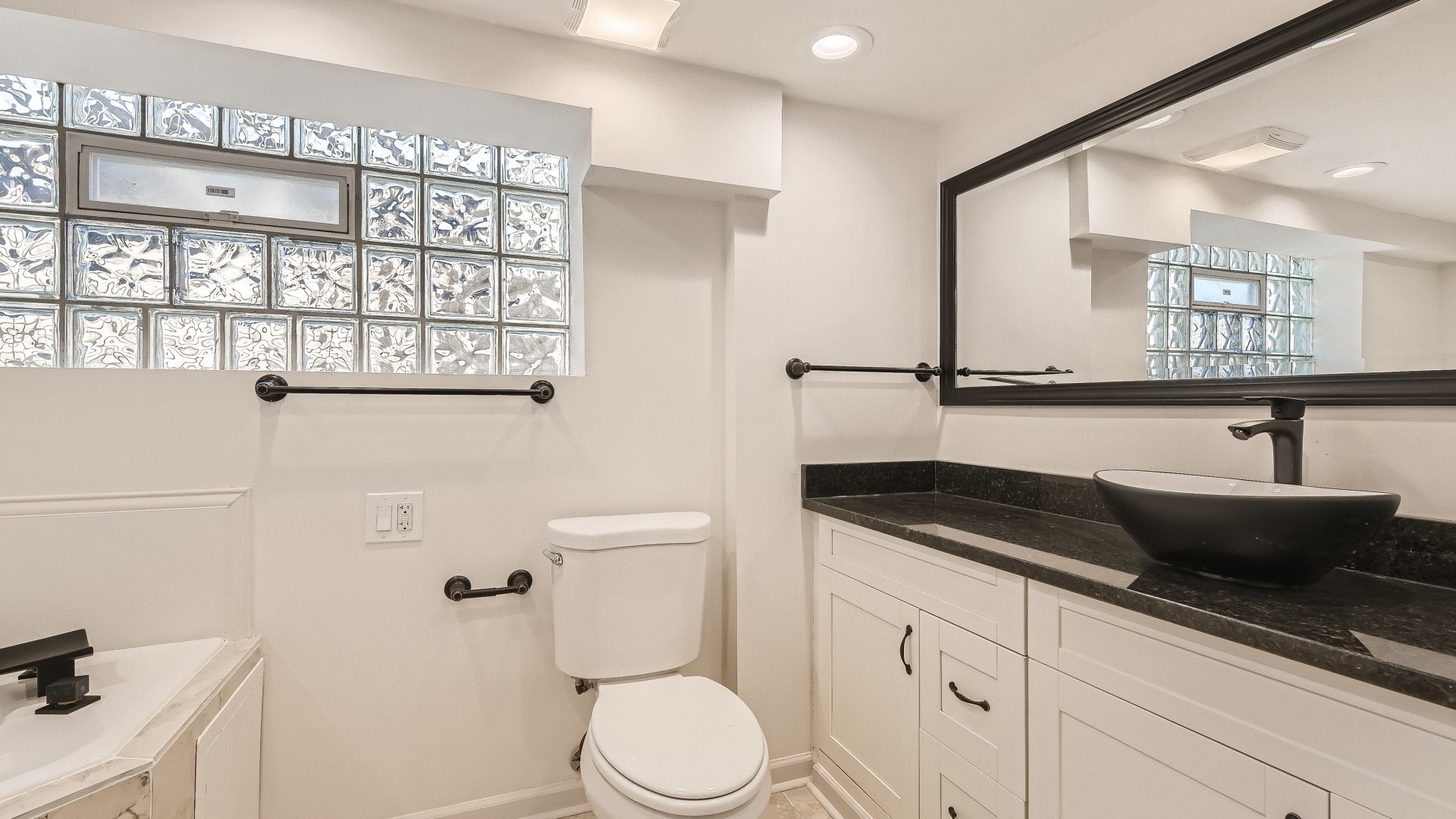 506 Pulaski Road Calumet City, IL 60409 - Photo 20 of 30 a bathroom with a granite countertop sink and a toilet