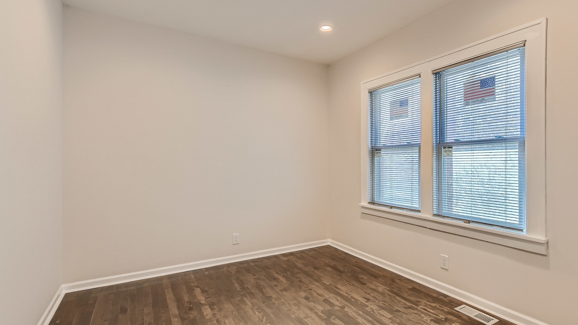 506 Pulaski Road Calumet City, IL 60409 - Photo 10 of 30 an empty room with wooden floor and windows