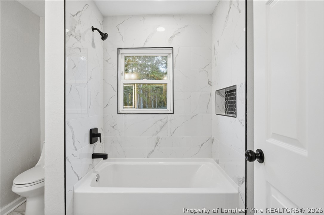 190 Payton Place Road Lumber Bridge, NC 28357 - Photo 23 of 43 a bathroom with a bathtub and shower