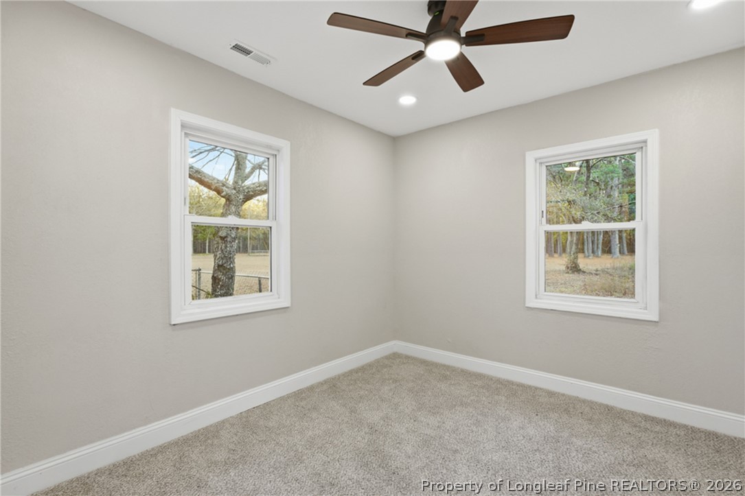 190 Payton Place Road Lumber Bridge, NC 28357 - Photo 27 of 43 an empty room with windows and fan