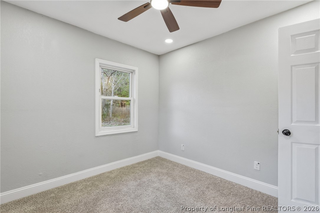190 Payton Place Road Lumber Bridge, NC 28357 - Photo 28 of 43 an empty room with a window and a ceiling fan