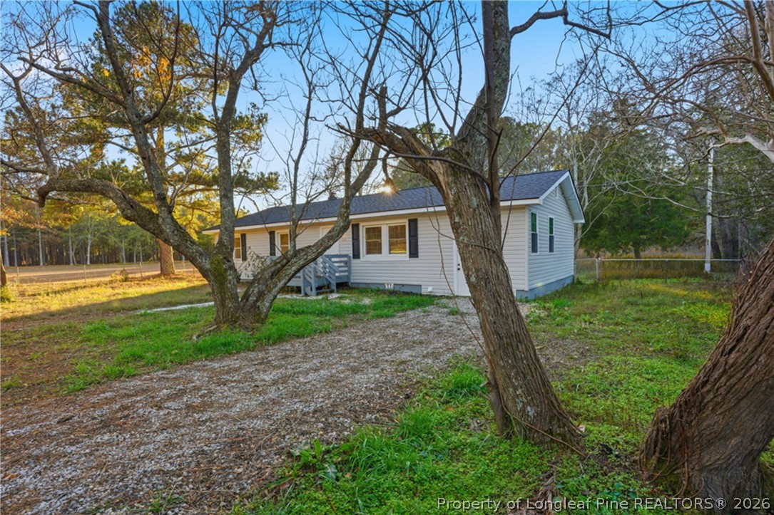 190 Payton Place Road Lumber Bridge, NC 28357 - Photo 3 of 43 a front view of a house with garden