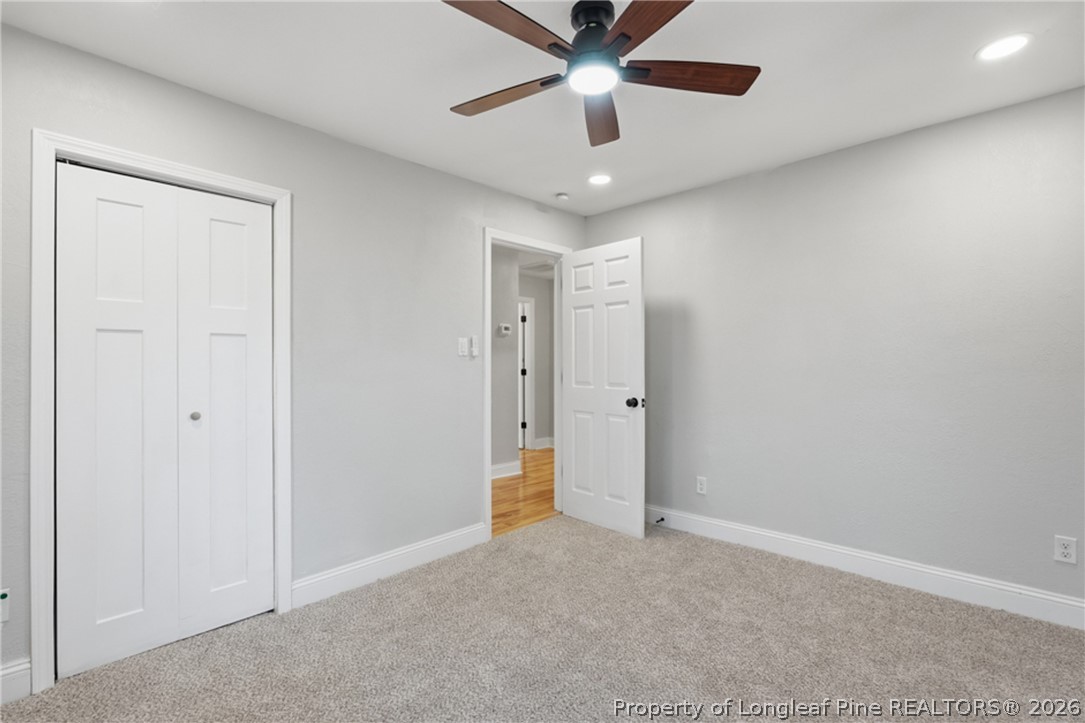 190 Payton Place Road Lumber Bridge, NC 28357 - Photo 33 of 43 an empty room with chandelier fan and windows