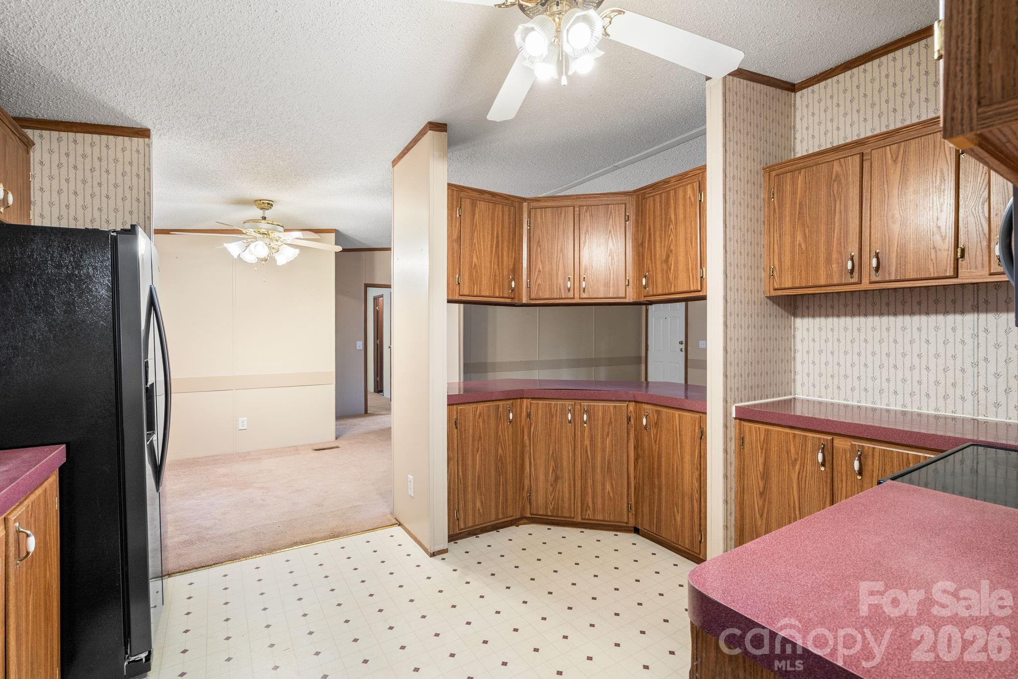 210 Ledbetter Lane Franklin, NC 28734 - Photo 18 of 32 a kitchen with a refrigerator and countertop