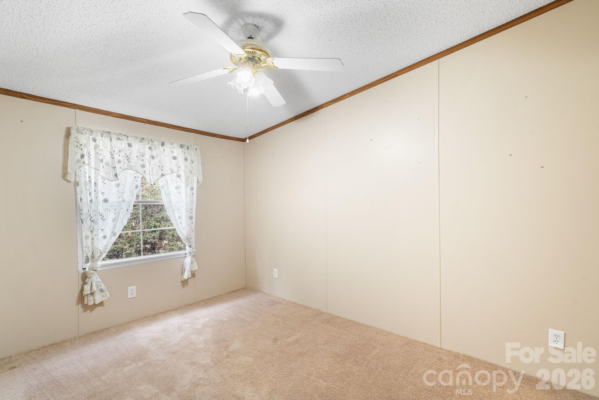210 Ledbetter Lane Franklin, NC 28734 - Photo 22 of 32 a view of a big room with windows and closet