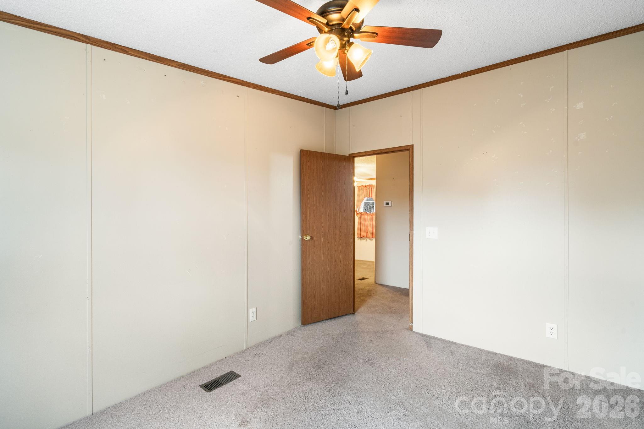 210 Ledbetter Lane Franklin, NC 28734 - Photo 23 of 32 a view of a hallway with a chandelier fan