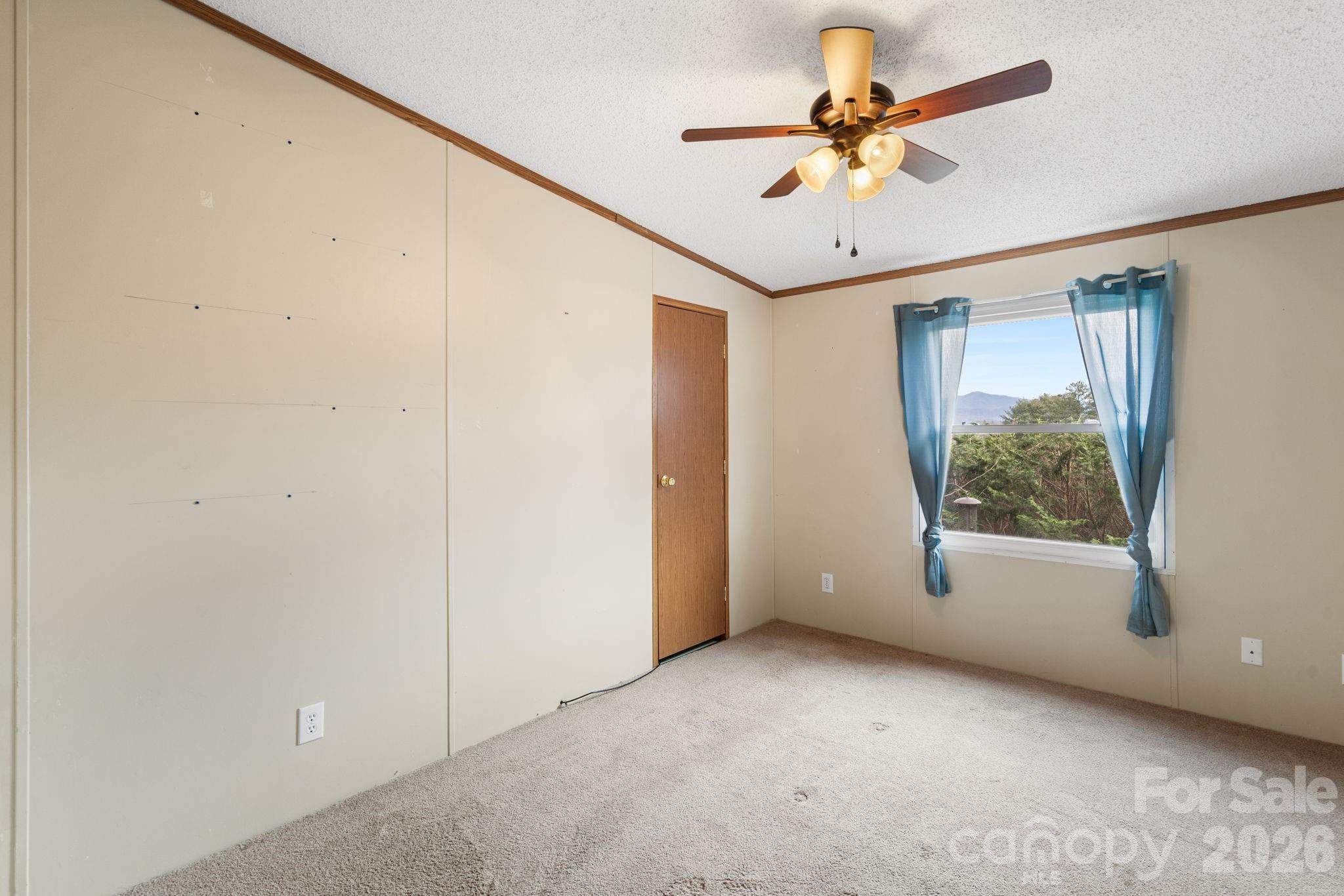 210 Ledbetter Lane Franklin, NC 28734 - Photo 24 of 32 a view of room with window and a ceiling fan