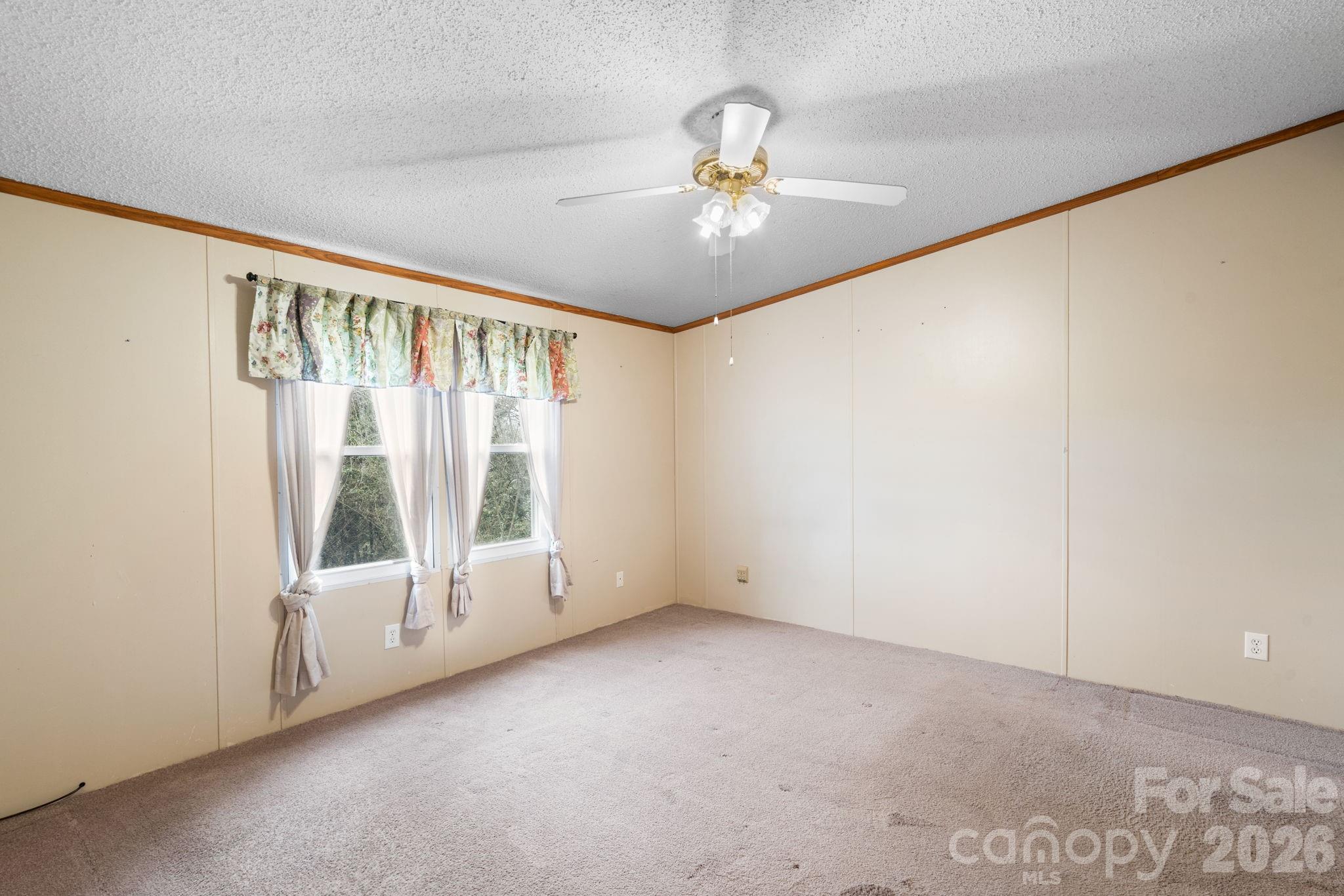 210 Ledbetter Lane Franklin, NC 28734 - Photo 27 of 32 a view of an empty room with a window