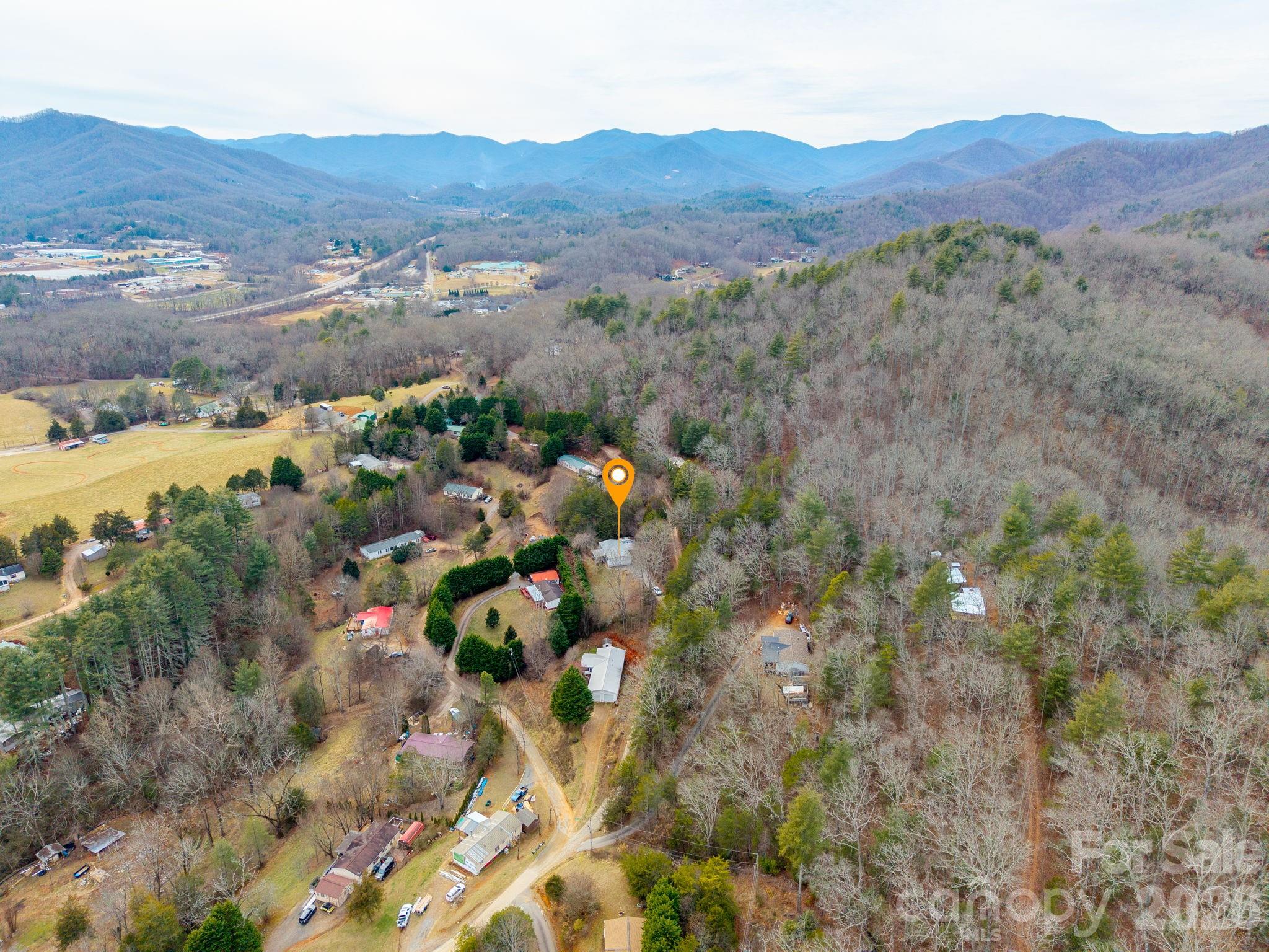 210 Ledbetter Lane Franklin, NC 28734 - Photo 32 of 32 a view of a lush green hillside and houses