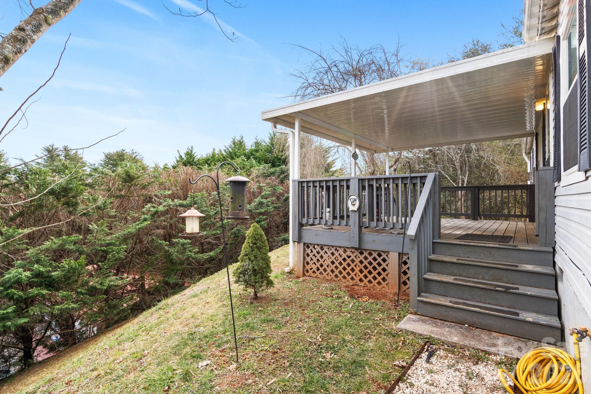 210 Ledbetter Lane Franklin, NC 28734 - Photo 6 of 32 a view of balcony with wooden floor and fence