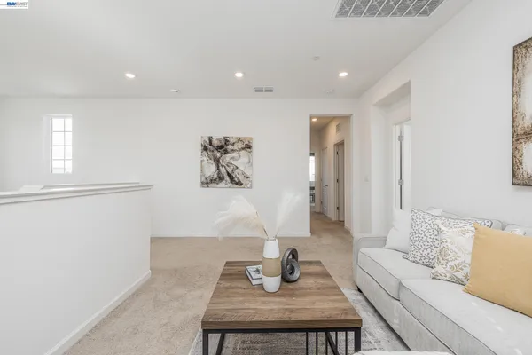 a living room with furniture and a table