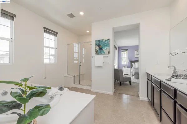 a spacious bathroom with a bathtub sink and toilet