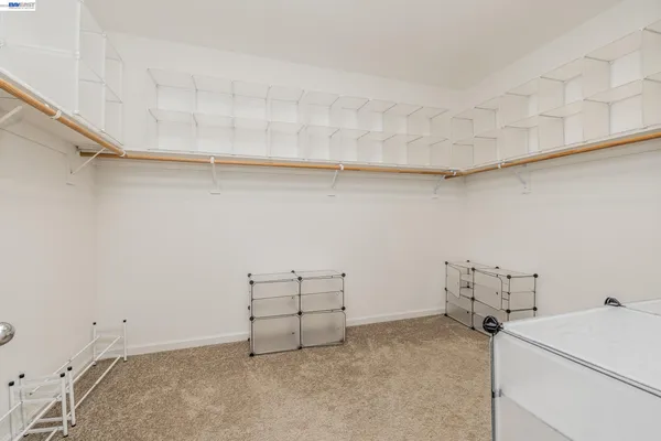 a view of storage and utility room with racks on the wall