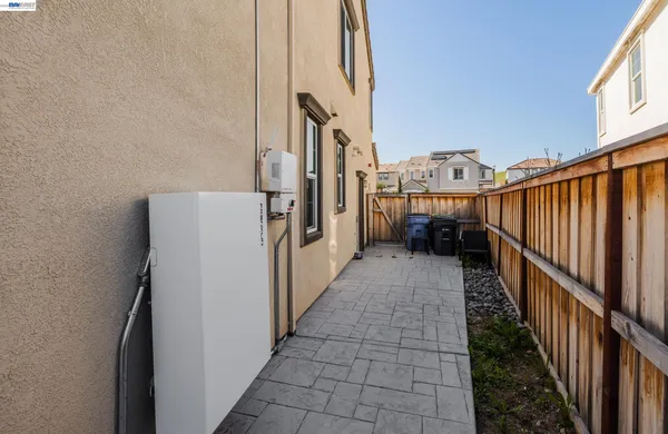 a sign board on the side of a street