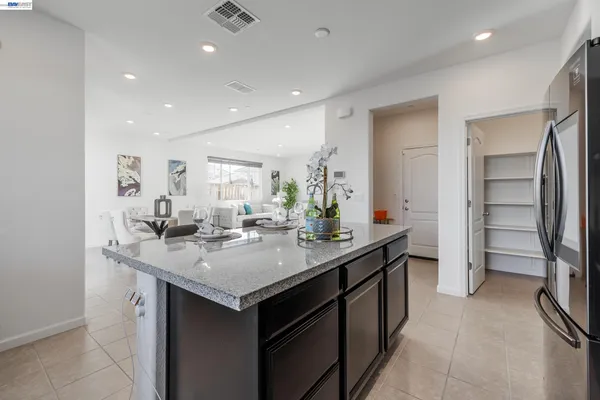 a kitchen with a sink and refrigerator