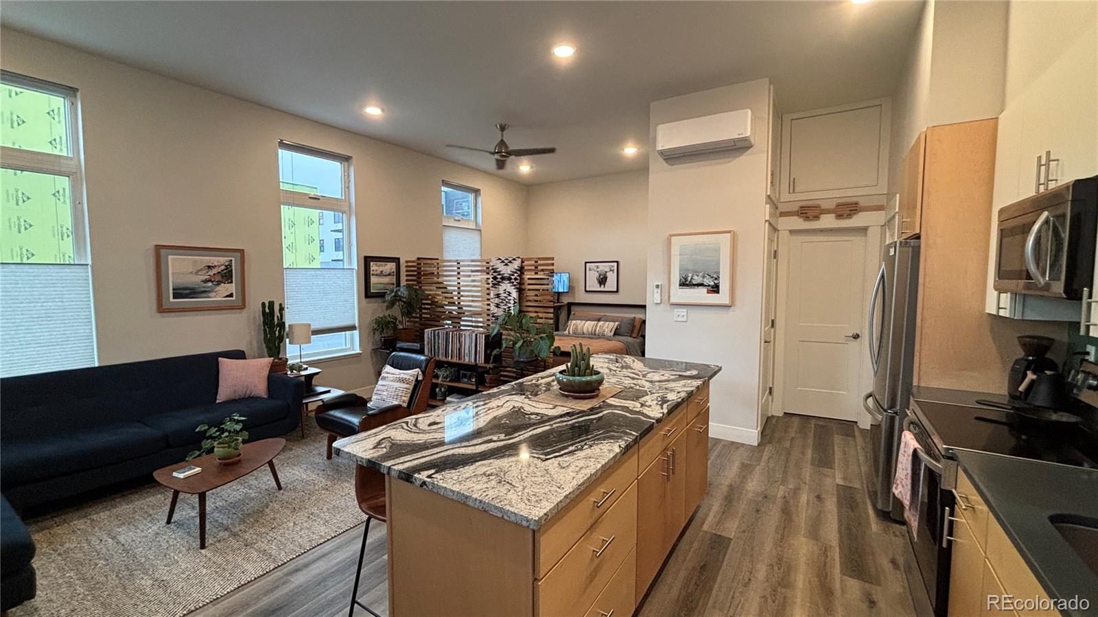 116 Old Stage Road, Unit B Salida, CO 81201 - Photo 4 of 20 a kitchen with stainless steel appliances granite countertop a stove refrigerator and a couch