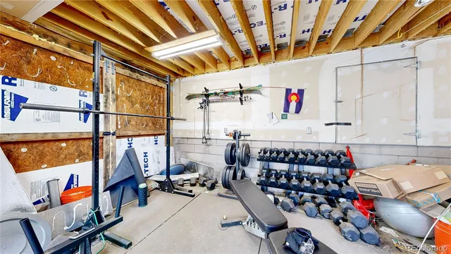 a balcony with wooden floor and fence