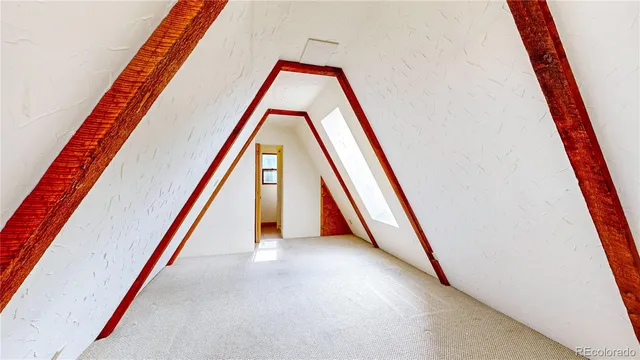 a kitchen with stainless steel appliances granite countertop a refrigerator a stove a sink dishwasher and white cabinets with wooden floor