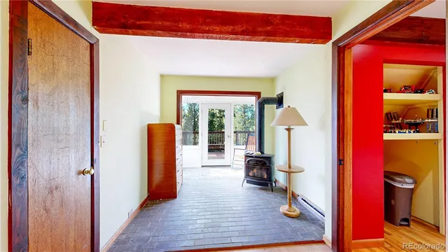 a view of a dining room with furniture a chandelier and wooden floor