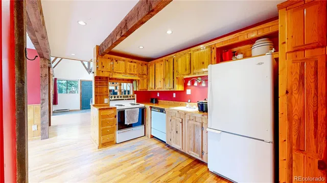 a view of living room with furniture and large windows