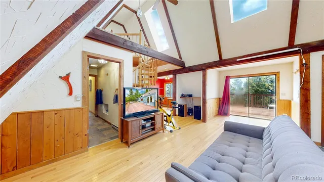 a view of a stairs and trees from a balcony
