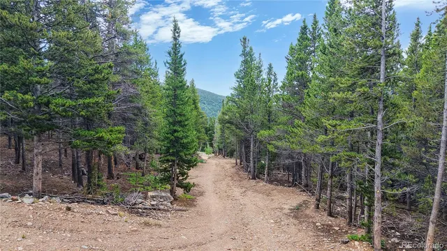a balcony with trees in front of it