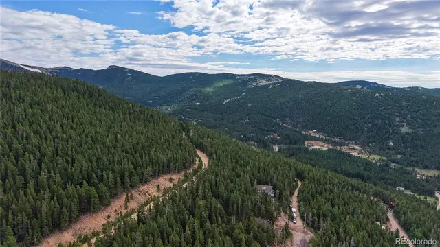 a view of a car park in front of a house