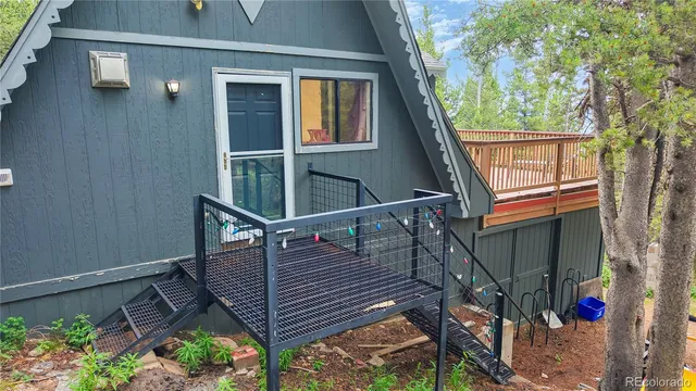 a view of balcony with wooden floor and fence