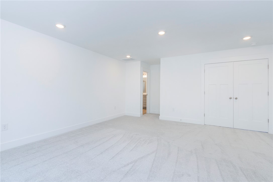 607 WH Kay Lane Anderson, SC 29621 - Photo 33 of 48 Recessed lighting illuminates this versatile space, featuring fresh carpeting and direct access to a private bathroom.