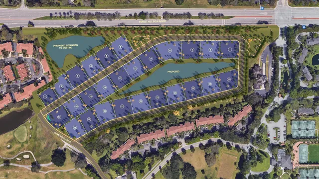 an aerial view of a wooden table and chairs