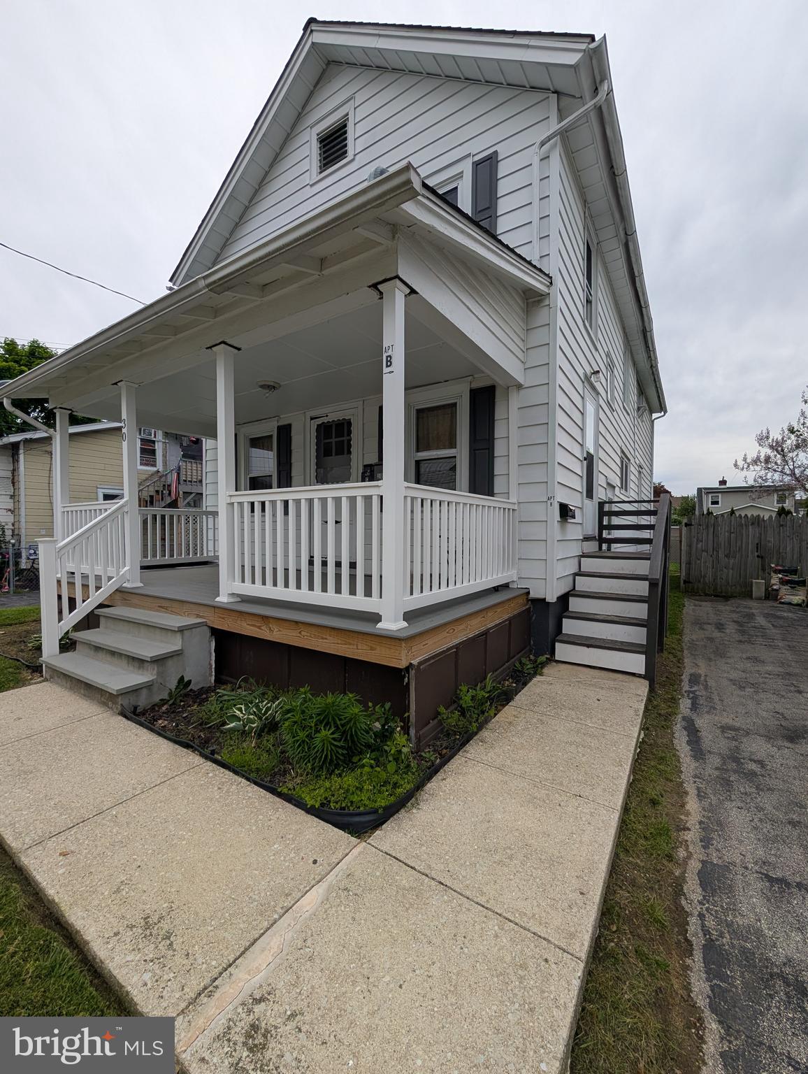 30 West Roland Road Brookhaven, PA 19015 - Photo 2 of 17 a view of a house with wooden fence