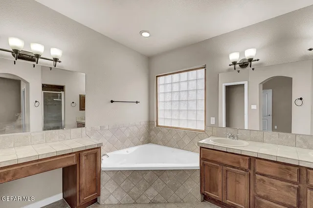 a bathroom with a bathtub and a shower