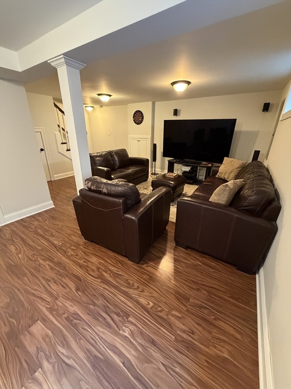 17 Cardinal Street, Unit 17 Winchester, MA 01890 - Photo 31 of 42 a living room with furniture and a flat screen tv