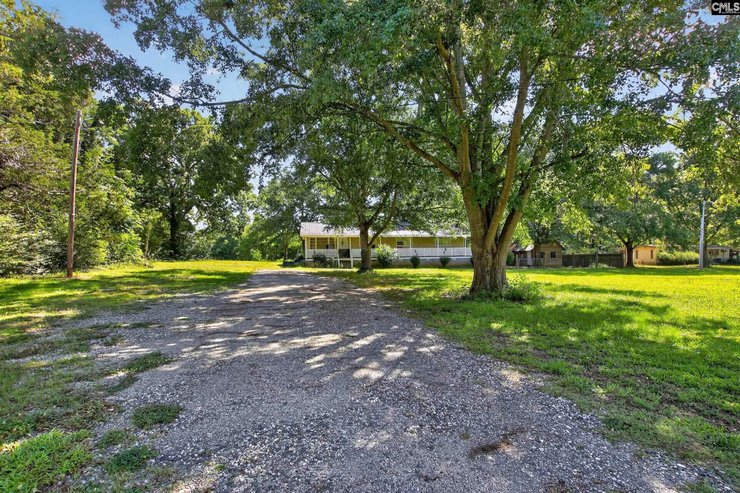 3140 Highway 702 Chappells, SC 29037 - Photo 26 of 39 a view of swimming pool with tree in the background