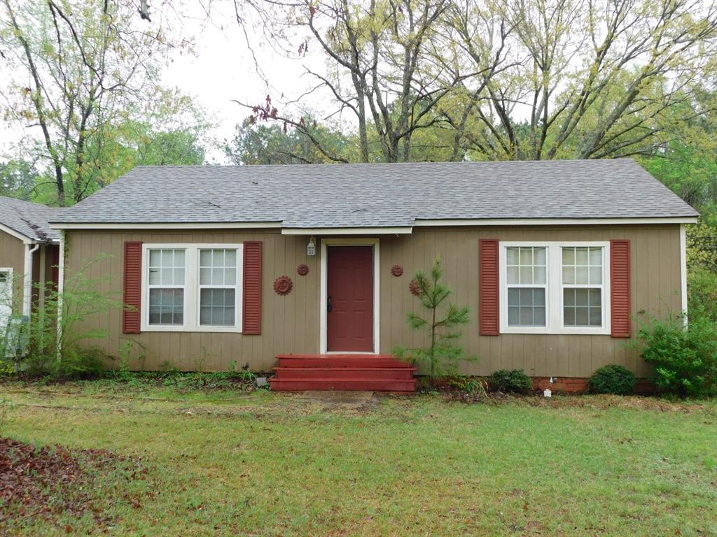 Single story home with crawl space, a front yard, and a shingled roof