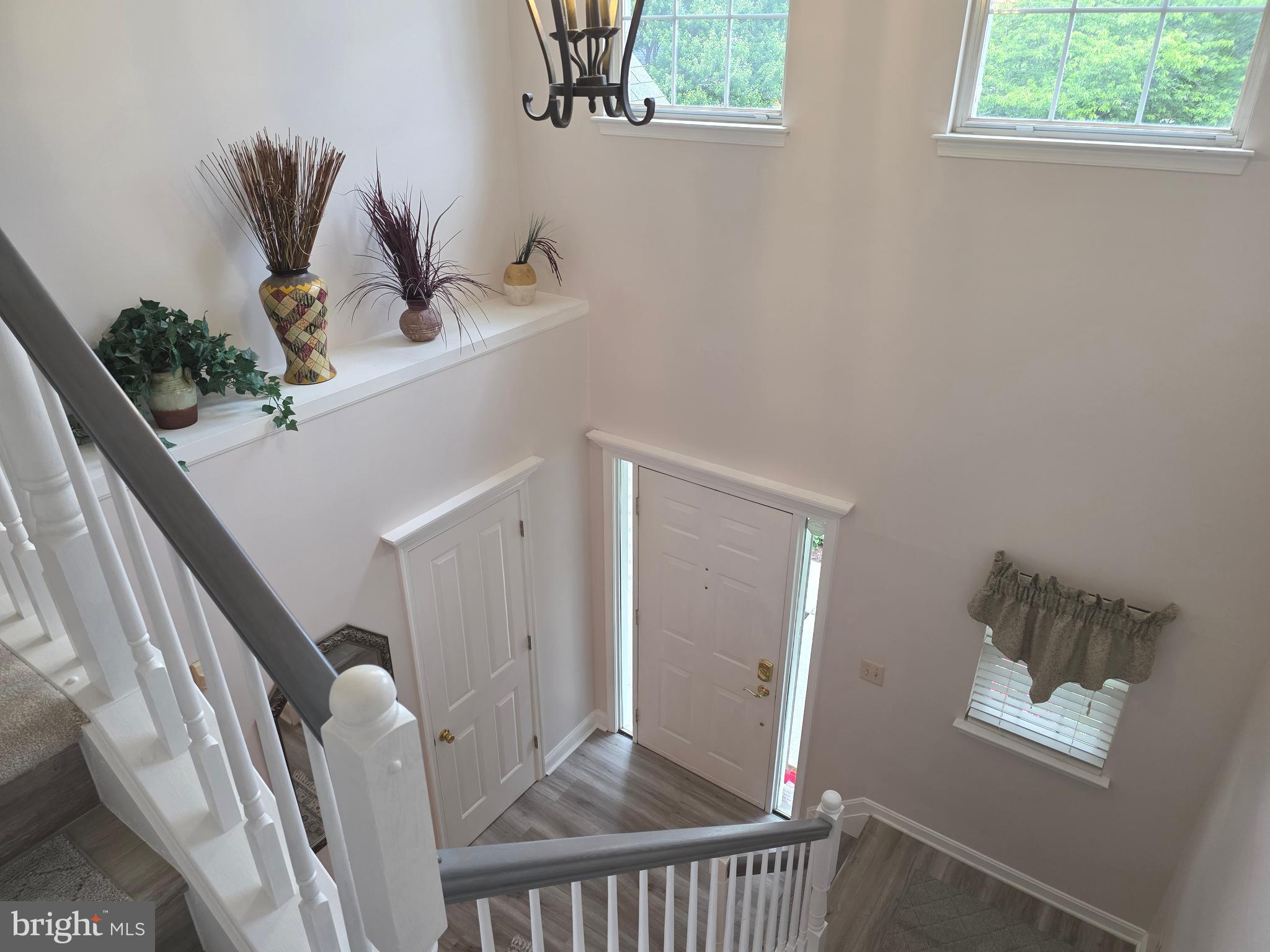 2441 Kemper Road Crofton, MD 21114 - Photo 32 of 63 a view of entryway and hall with wooden floor