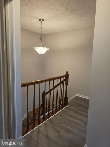 a view of a hallway with windows