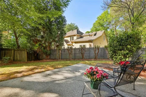 a view of a backyard with a sitting area