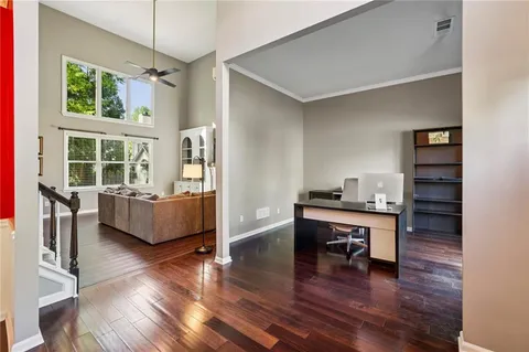 a living room with furniture wooden floor and a table