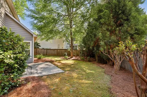 a view of a yard with a tree