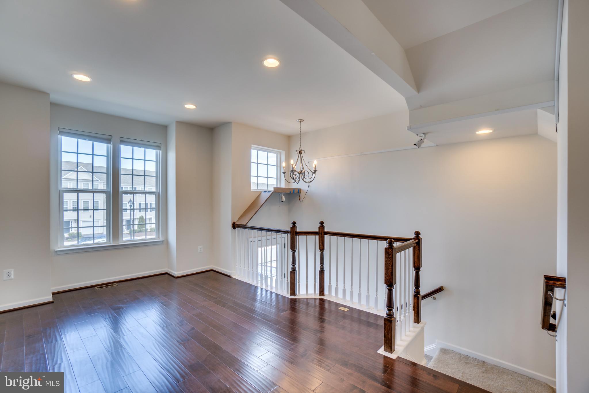 8385 Scotland Loop, Unit 68 Manassas, VA 20109 - Photo 12 of 30 Hardwood floors and foyer