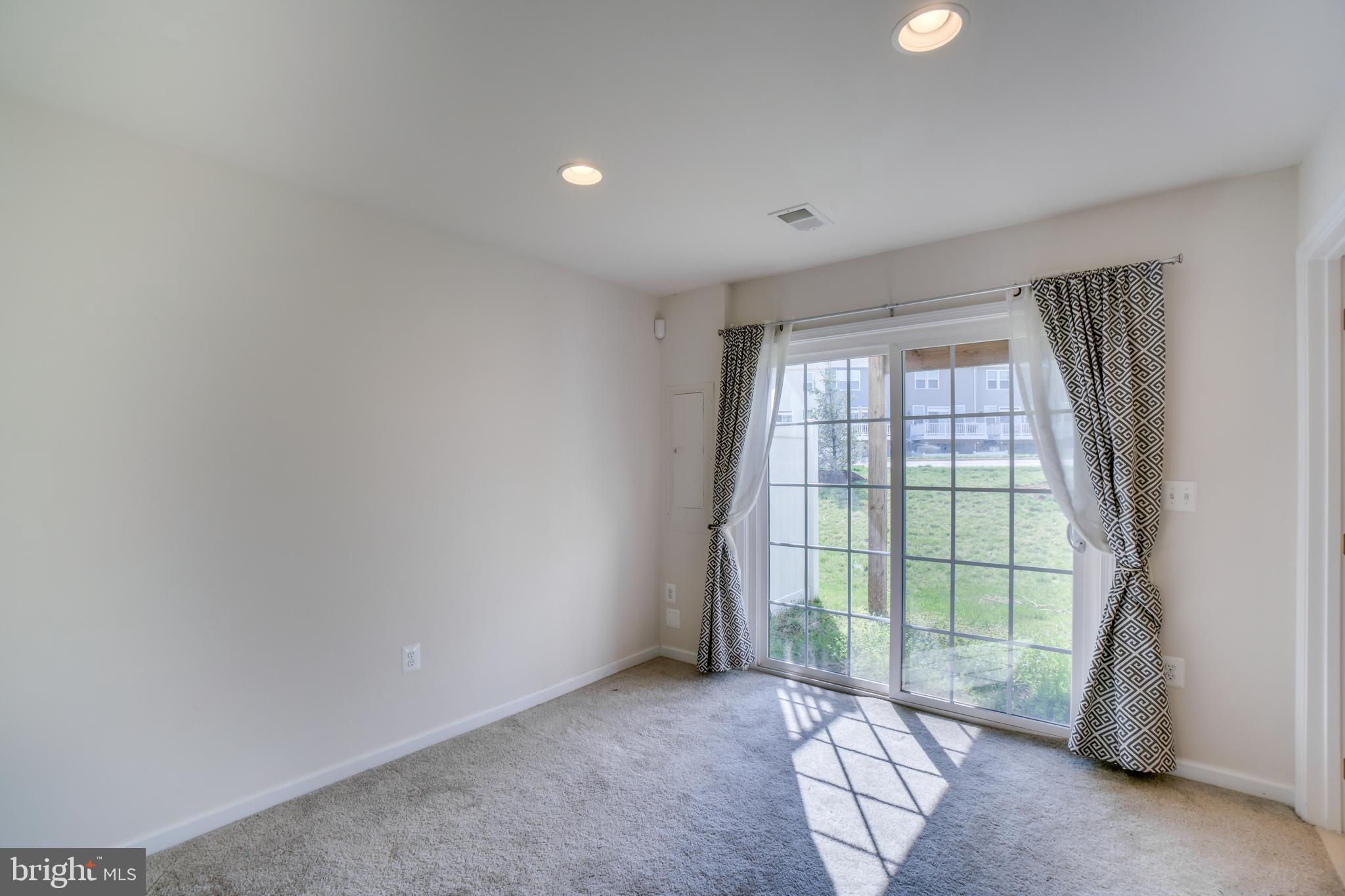 8385 Scotland Loop, Unit 68 Manassas, VA 20109 - Photo 27 of 30 Lower level with view of backyard