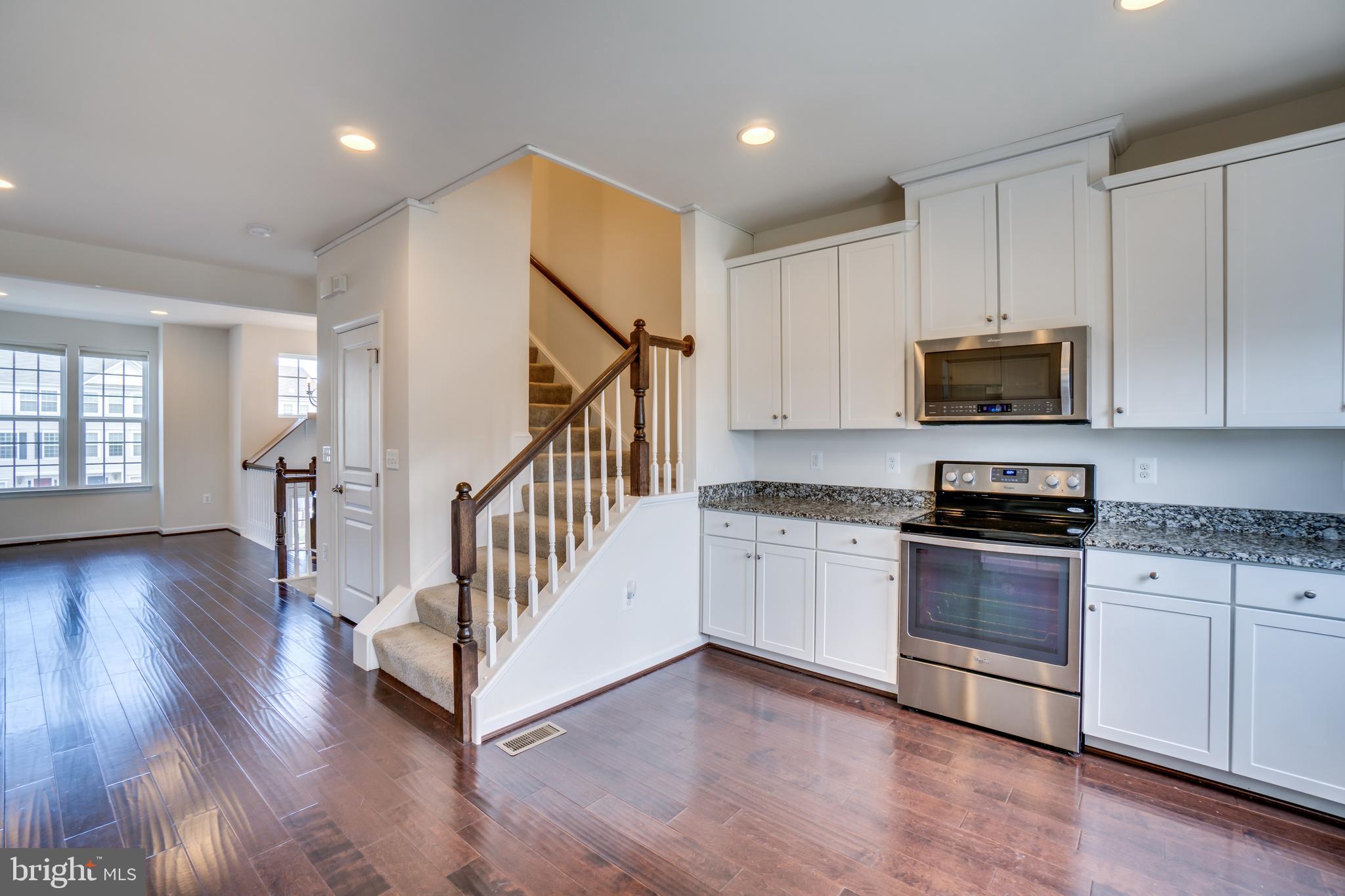 8385 Scotland Loop, Unit 68 Manassas, VA 20109 - Photo 6 of 30 Kitchen and stairs to bedrooms