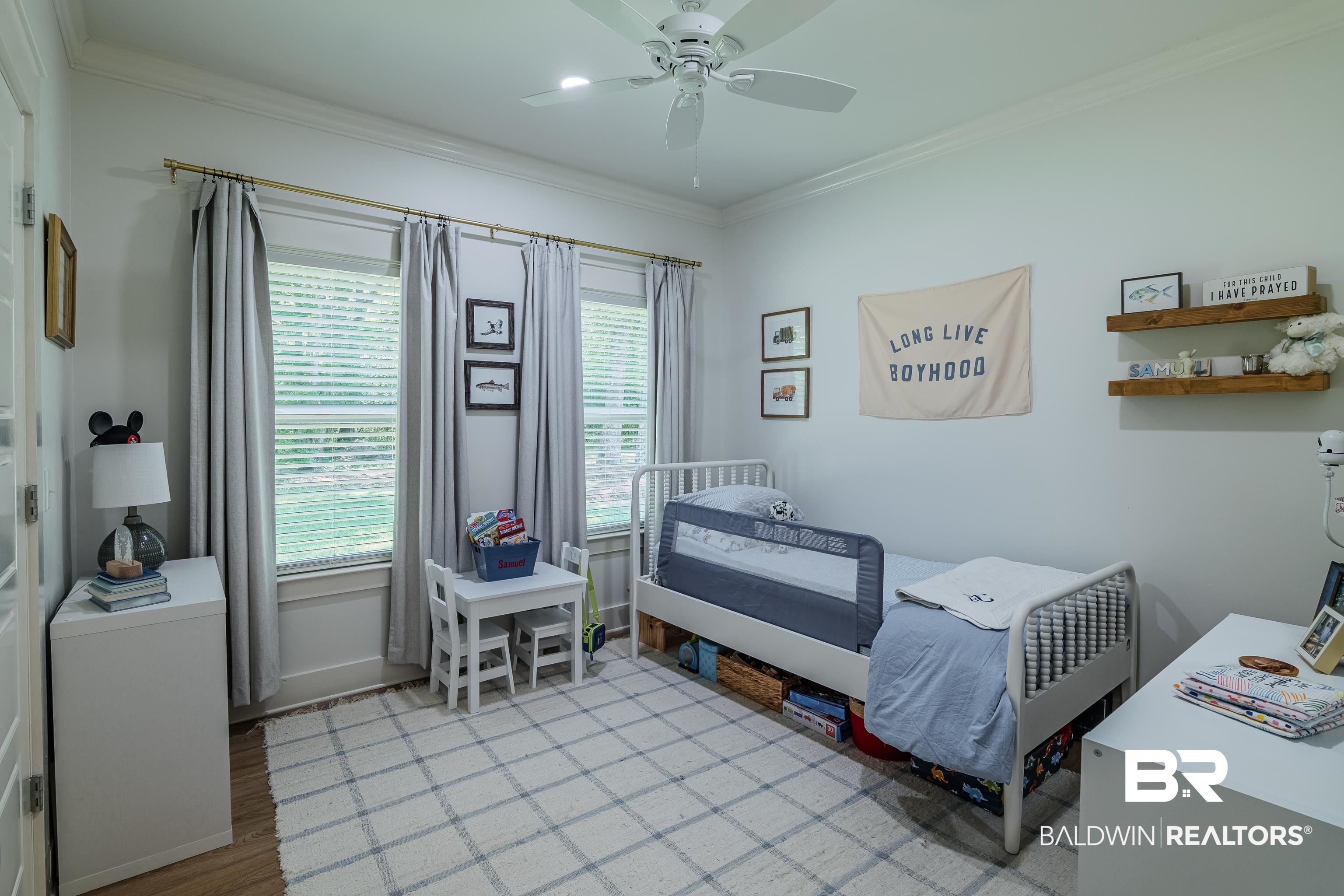 19121 Boothe Road Fairhope, AL 36532 - Photo 23 of 41 Bedroom featuring a ceiling fan, crown molding, and light wood-style flooring
