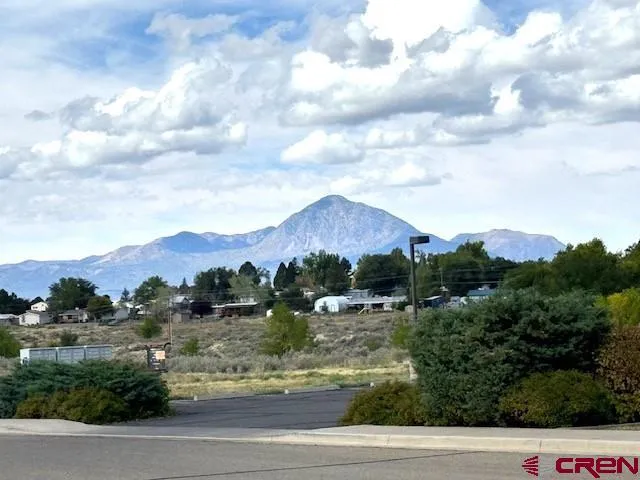 an aerial view of residential house with outdoor space and lake view