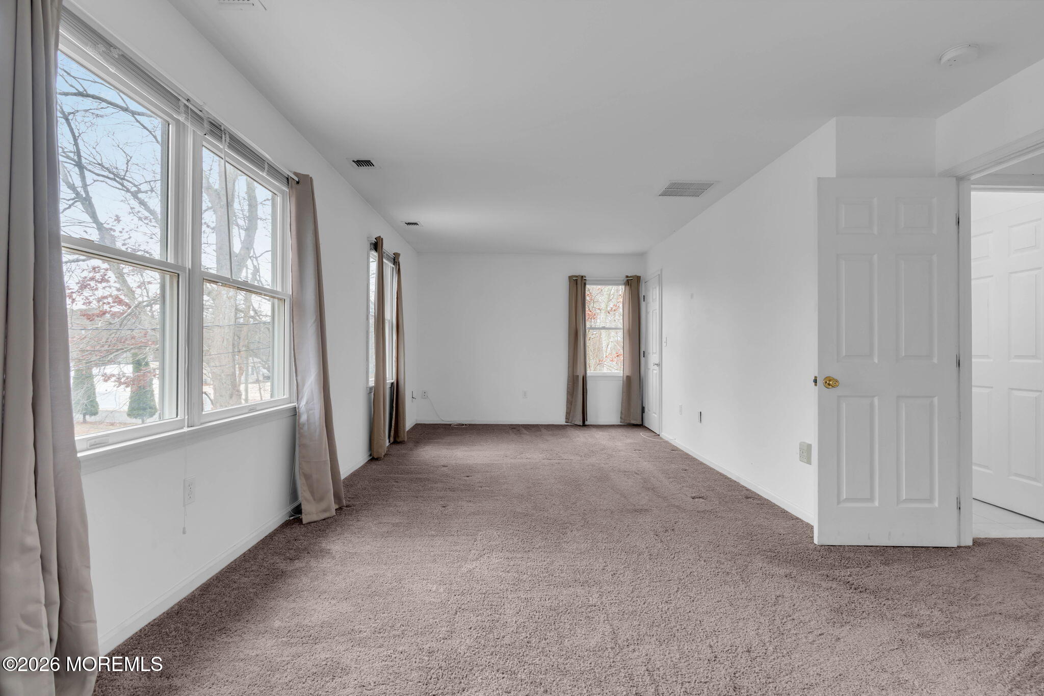 9 Forecastle Way Waretown, NJ 08758 - Photo 27 of 51 a view of a big room with windows and chandelier